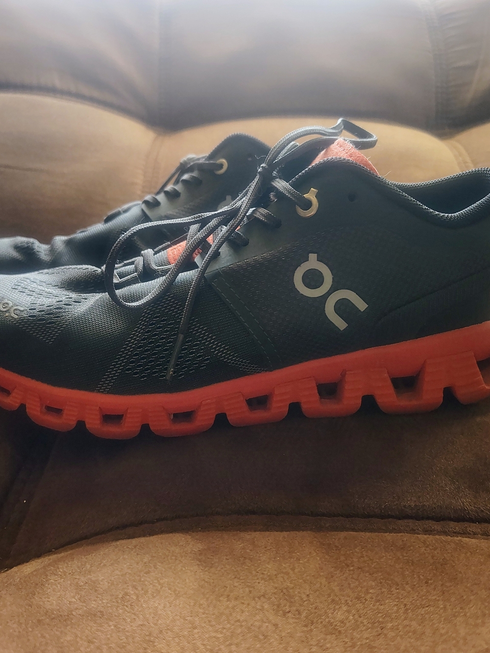 On Running Men’s Athletic Shoes in Black with Orange Sole